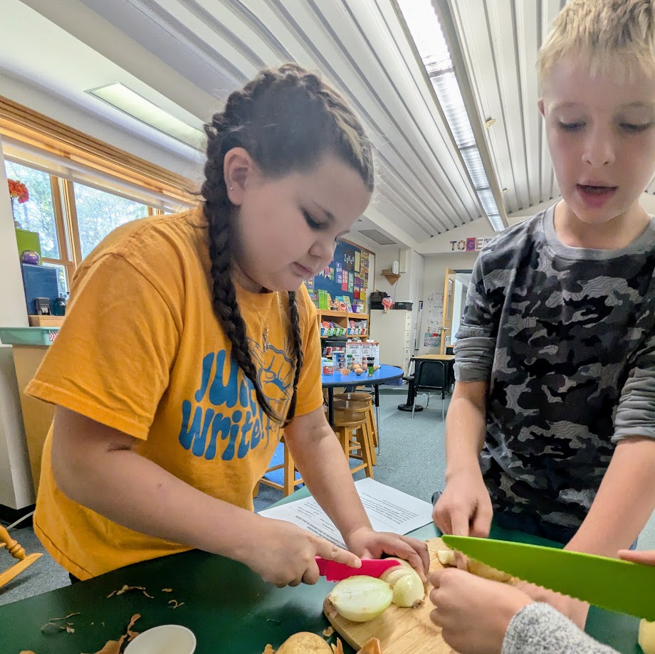 students chopping vegetables